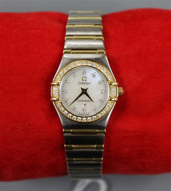A ladys steel, yellow metal and diamond set Omega Constellation quartz wrist watch,